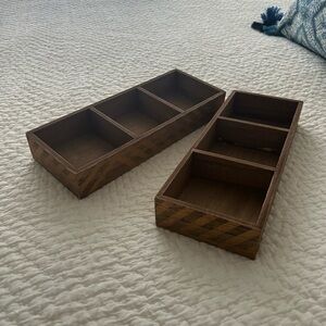 Two brown wood organizers